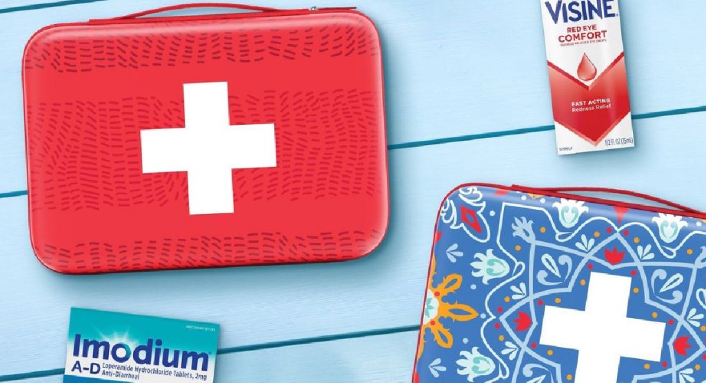 two Johnson & Johnson First Aid Kit Bags displayed with items around it