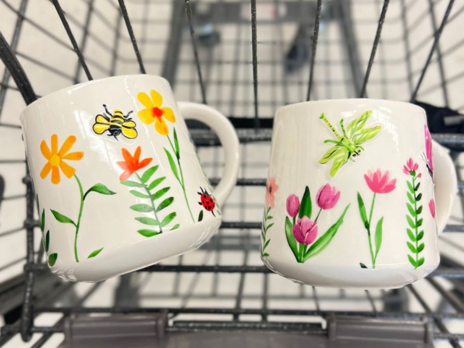 white ceramic coffee mugs with spring flowers, butterflies and bees in walgreens cart