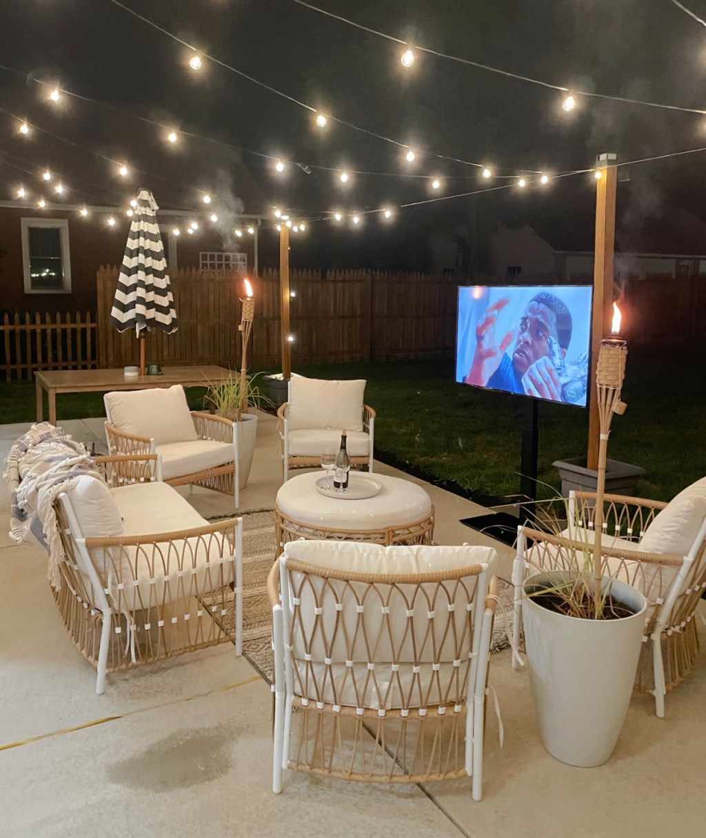 walmart outdoor furniture set up with lights and a tv screen