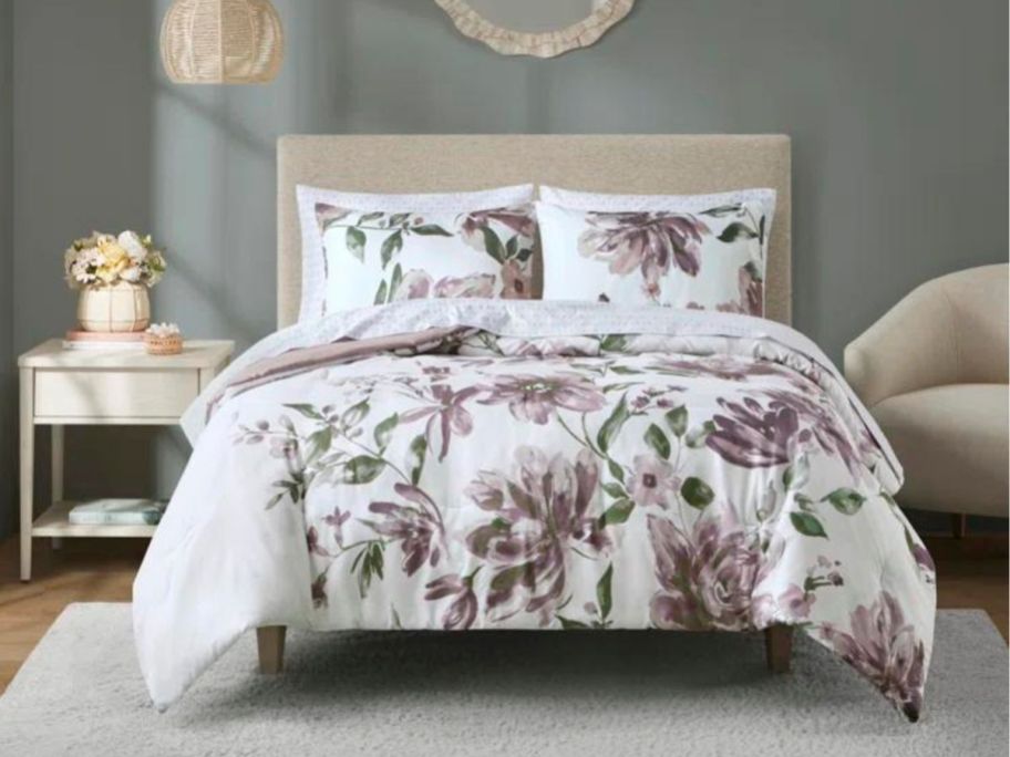 floral comforter set on bed in bedroom