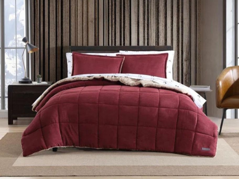 red comforter set on bed in bedroom