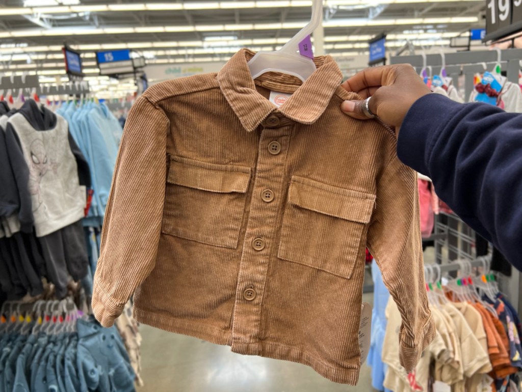 woman hold corduroy shacket at the store