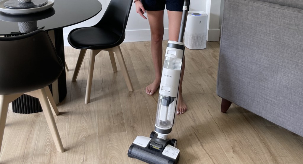 woman using the Tineco iFloor 3 Cordless Wet_Dry Hard Floor Vacuum in her home