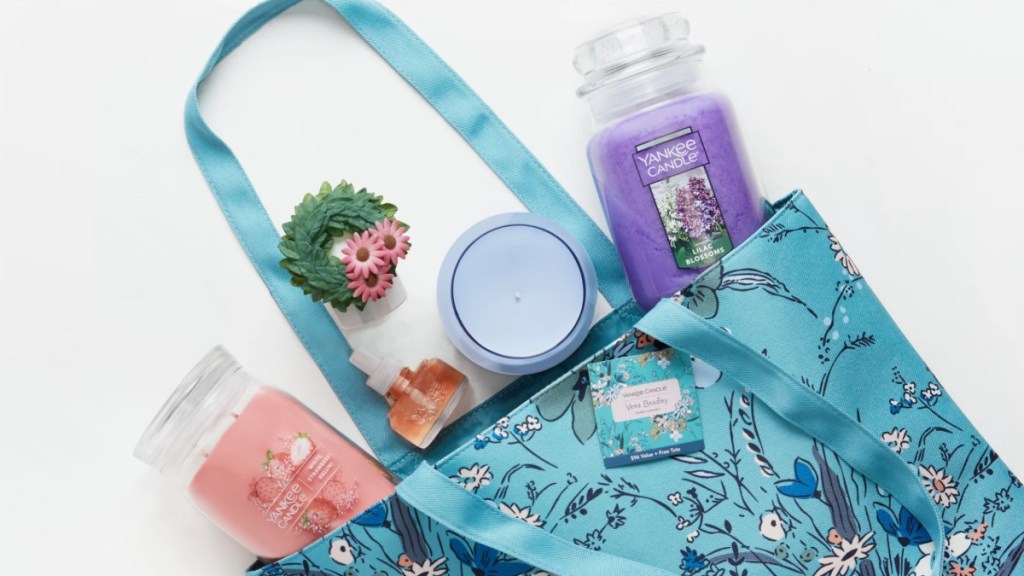 blue floral bag containing Yankee Candle products
