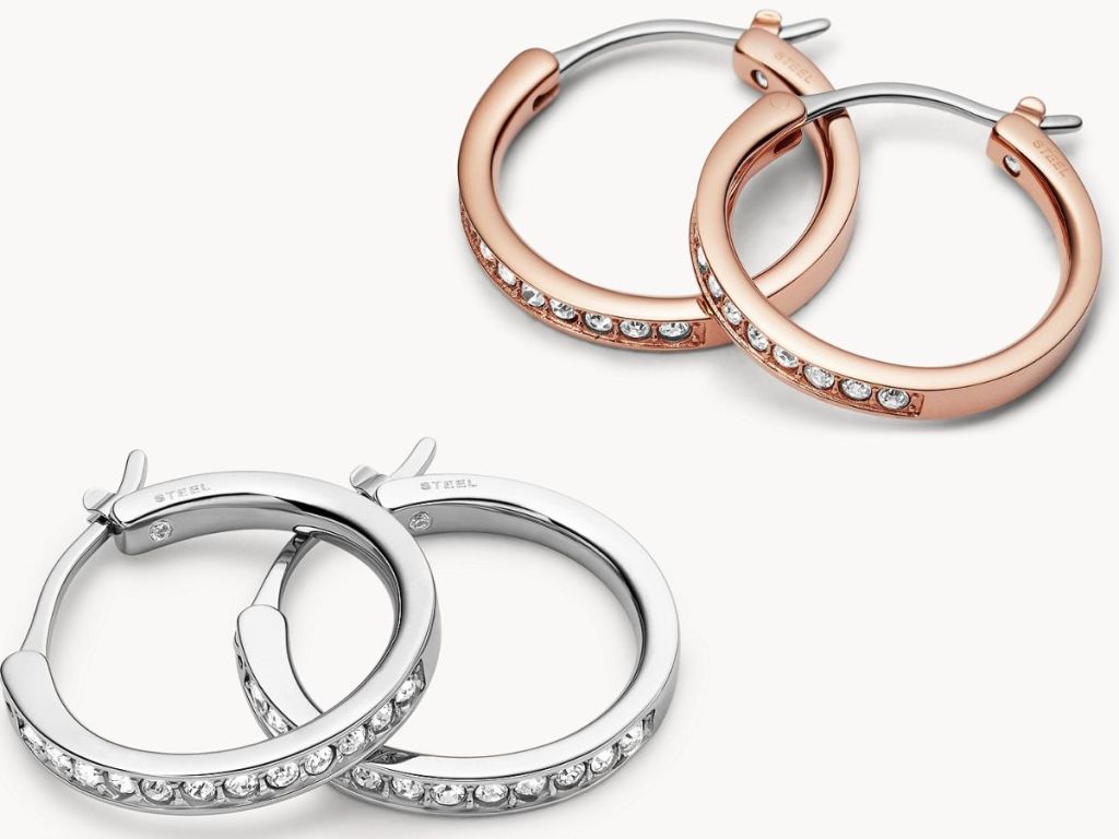 two pairs of fossil hoop earrings in silver and rose gold with inset crystals on hoop