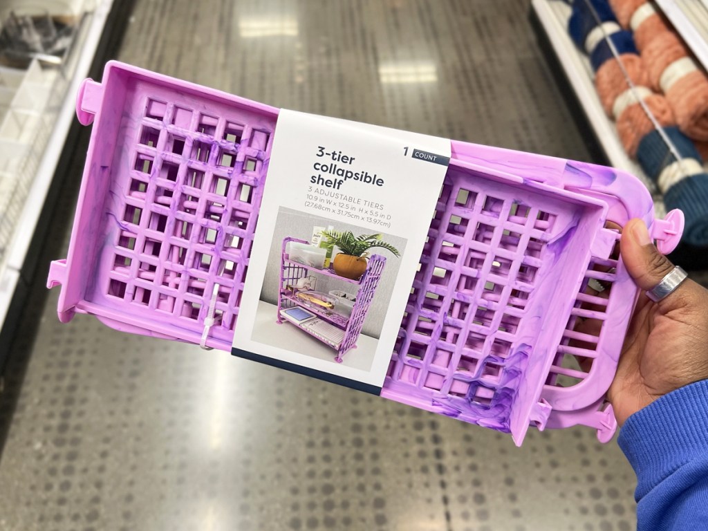 hand holding a purple 3-Tier Collapsible Shelf