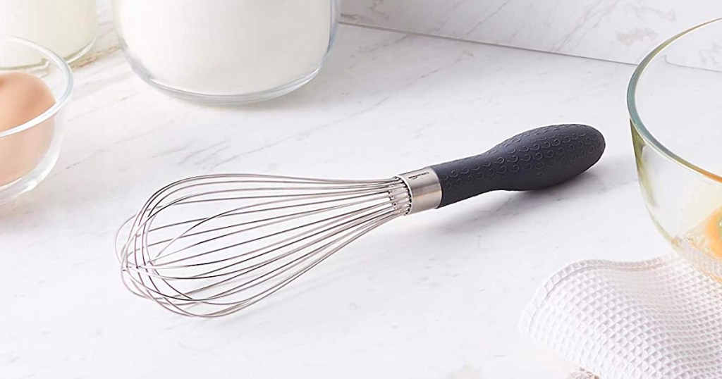 Amazon Basics Stainless Steel Wire Whisk sitting on a kitchen counter
