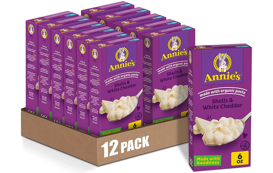 12 purple boxes of Annie’s White Cheddar Shells Macaroni & Cheese