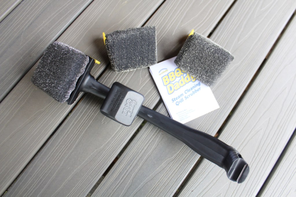 The BBQ Daddy Steam Cleaning grill brush with two replacement scrubbers