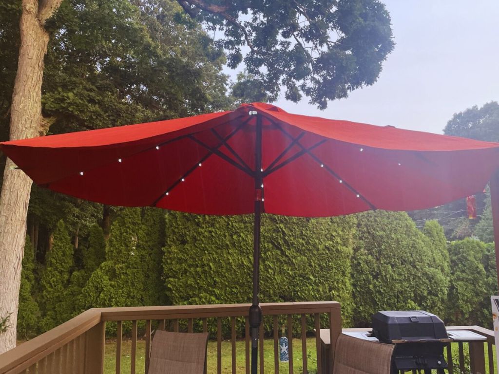 red umbrella with lights on deck