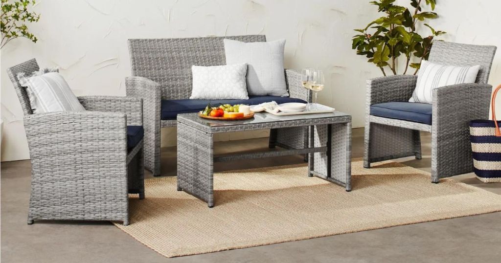 2 wicker chairs, wicker love seat and wicker table with glass top