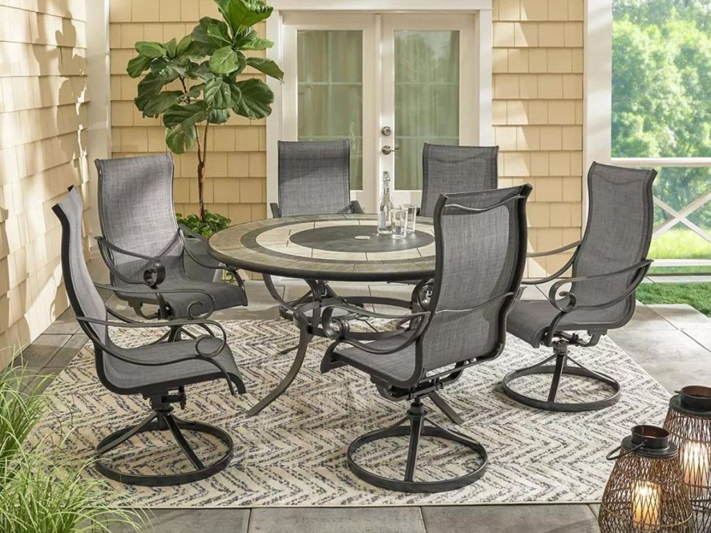 Patio dining set with chairs and a round table