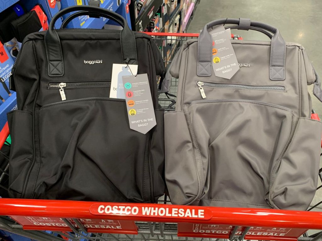 Two Baggallini Soho Backpacks in the front basket of a Costco shopping cart