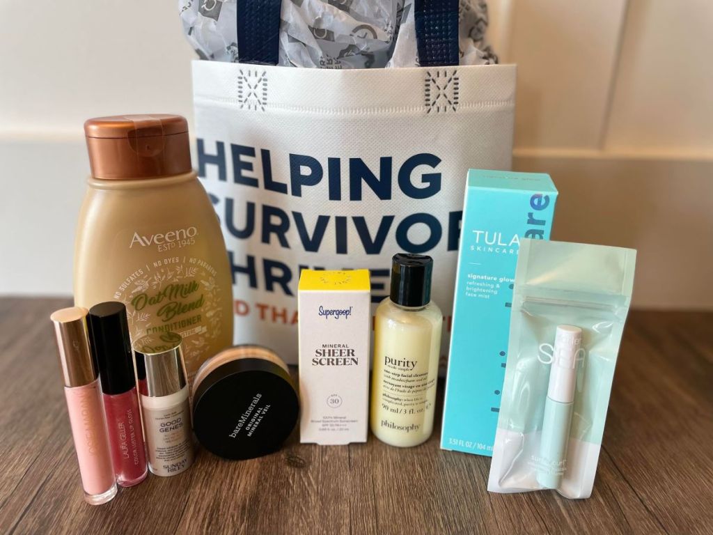 Beauty products and samples next to a reusable tote bag