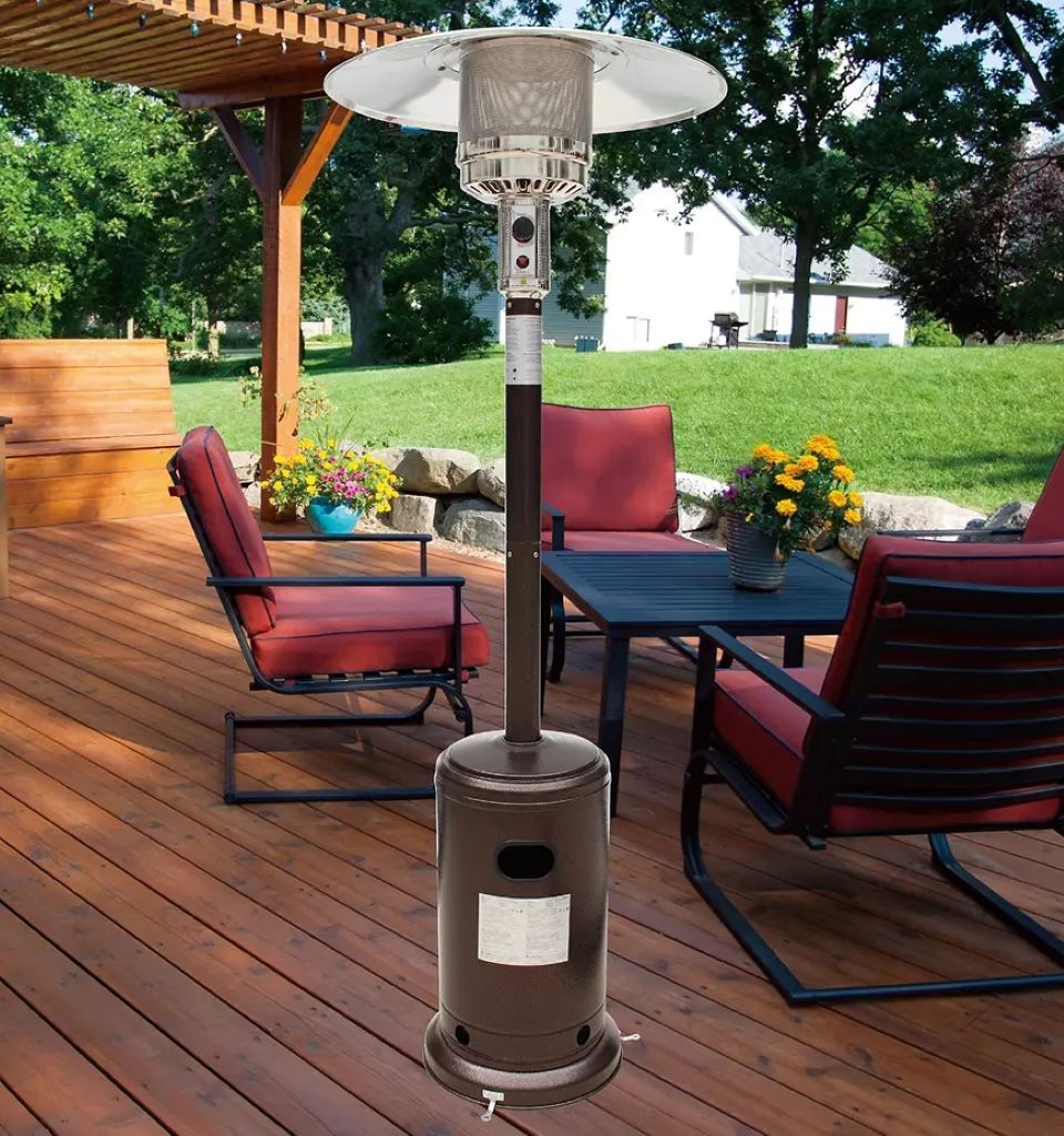Outdoor propane heater on a patio with furniture behind it