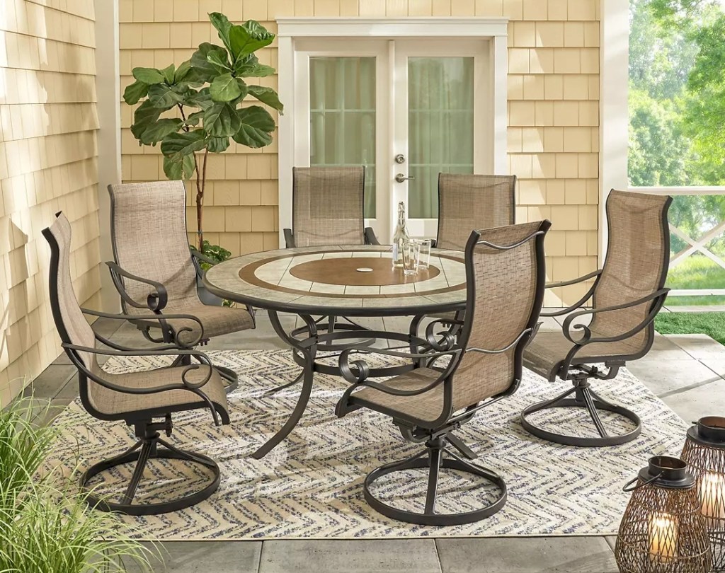 Patio dining set with chairs and a table