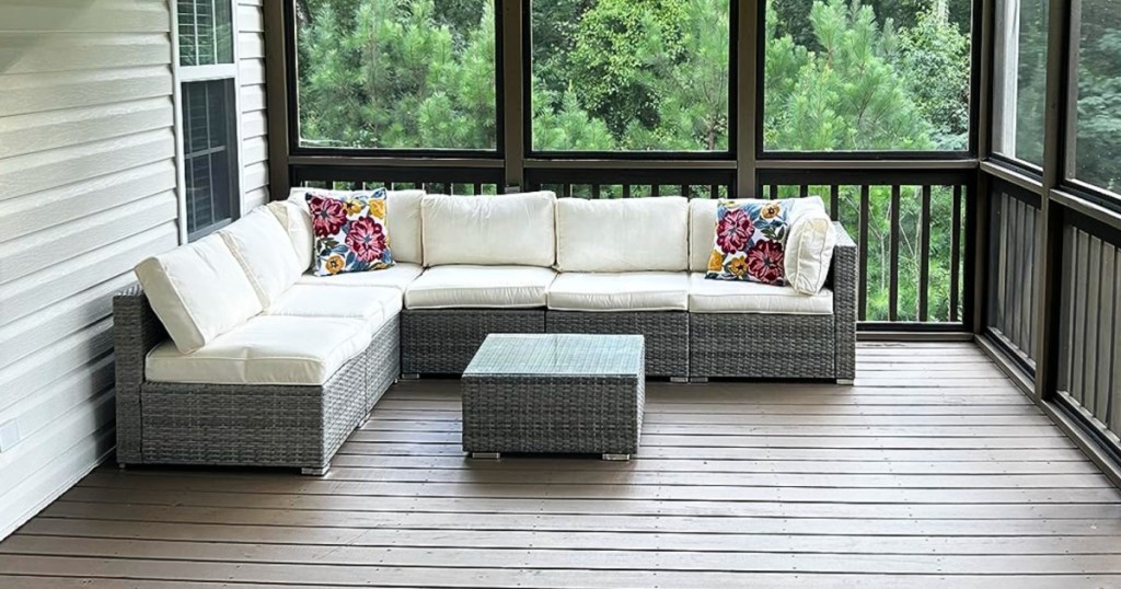 white outdoor sectional on screened in porch