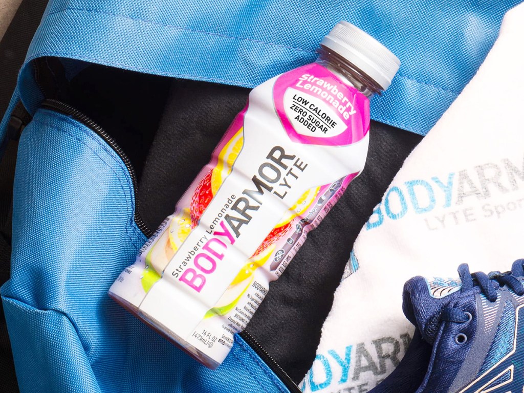 bottle of bodyarmour sports drink on top of gym bag