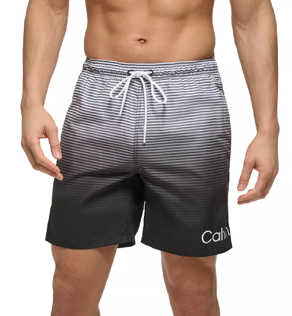Man wearing a pair of mens designer calvin klein swim trunks