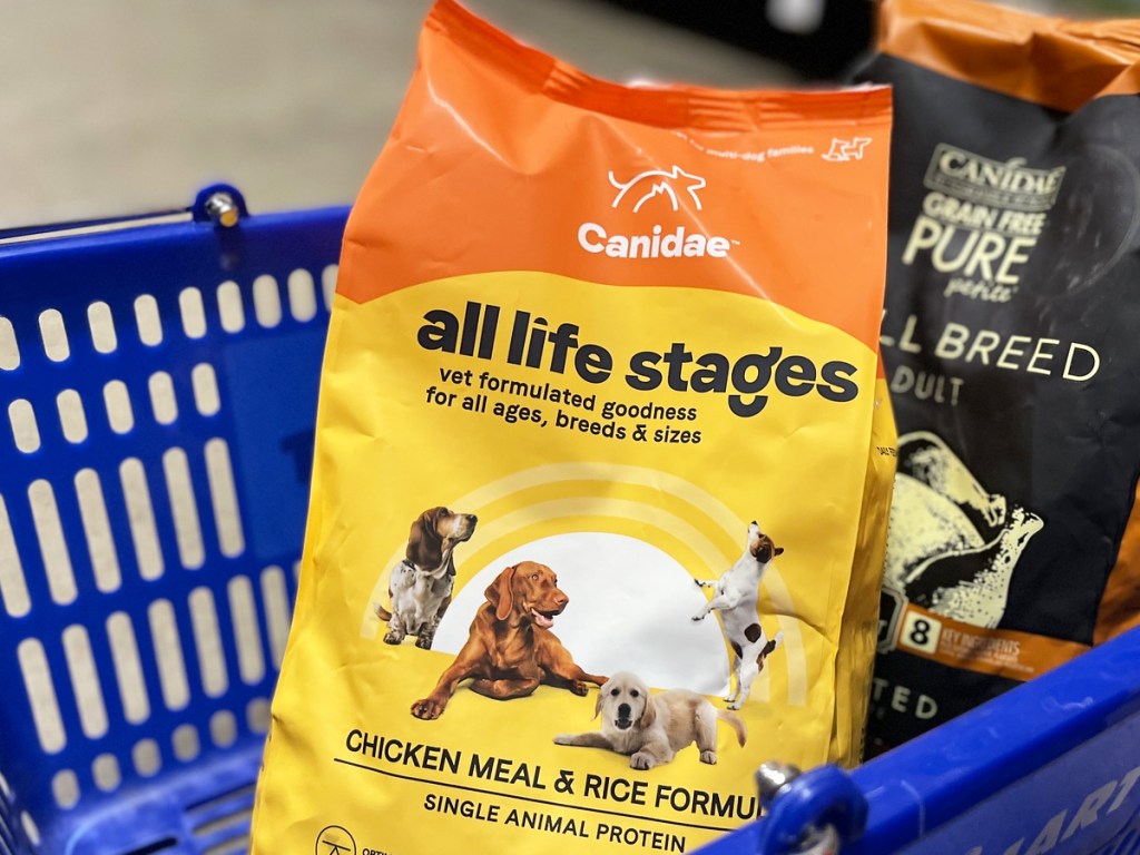 yellow bag of Canidae Dog Food in blue shopping basket