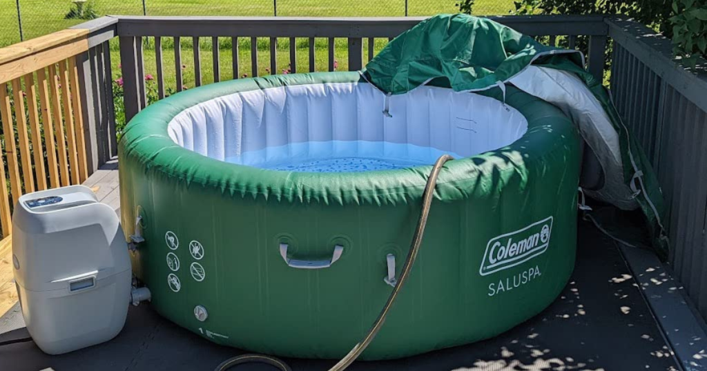 A green inflatable hot tub on a deck 