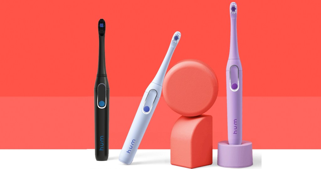 black, blue, and purple electric toothbrushes