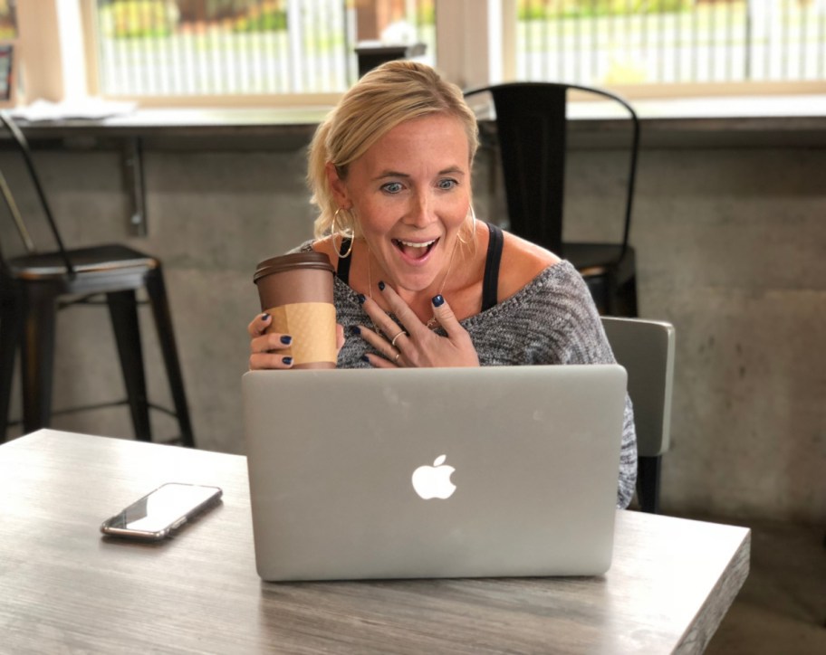 Collin looking excitedly at her computer