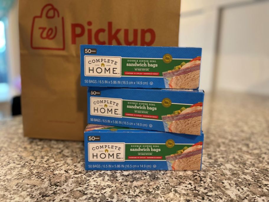 Three boxes of sandwich bags next to a Walgreens bag