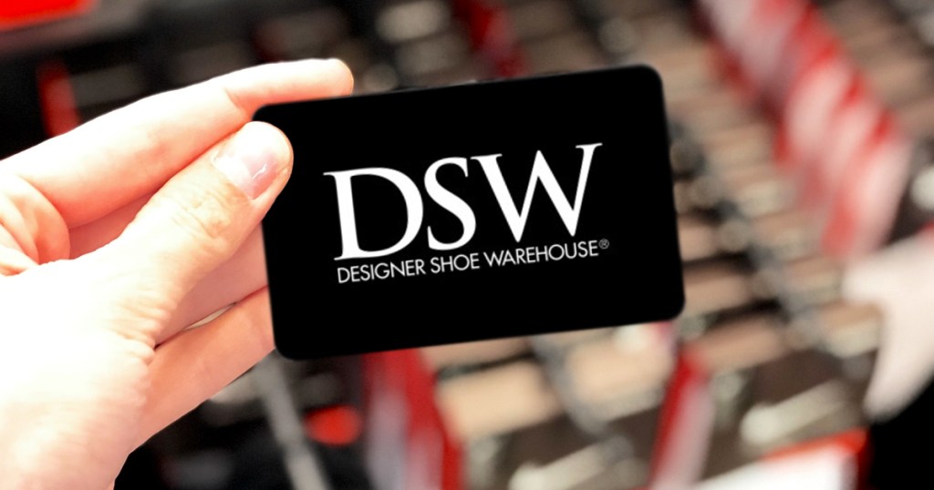 hand holding a DSW gift card