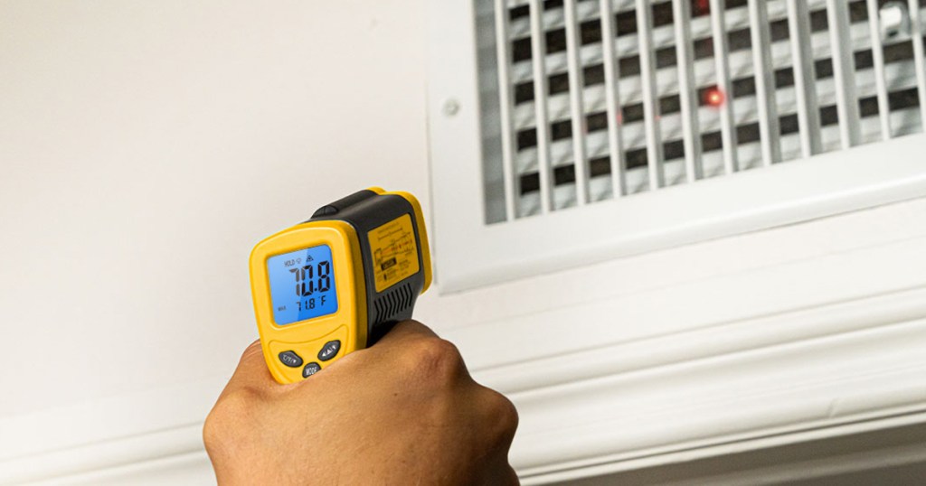 pointing infrared thermometer a heater vent