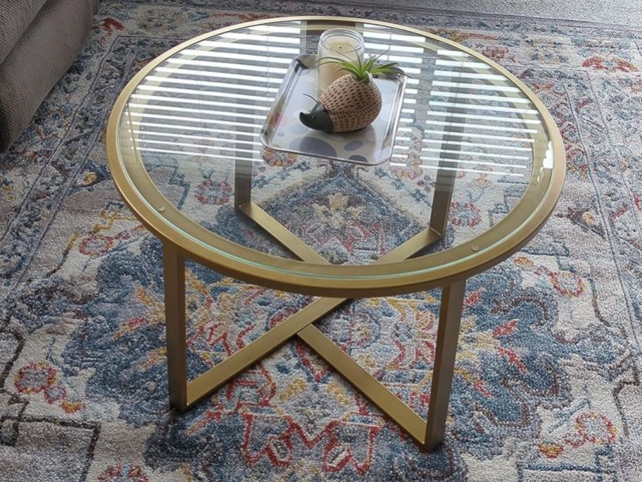 Gold coffee table on a rug
