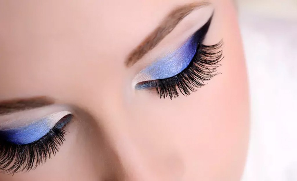 woman with blue eyeshadow and lash extensions