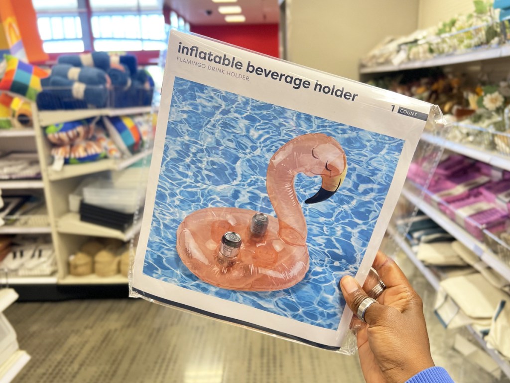 hand holding a Flamingo Inflatable Beverage Holder