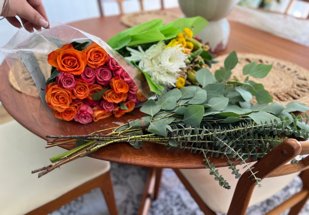 Various grocery store flowers on a table