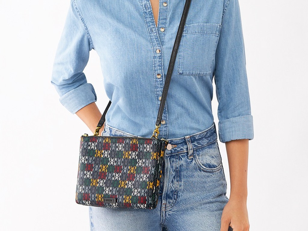 woman in denim outfit with black fossil crossbody