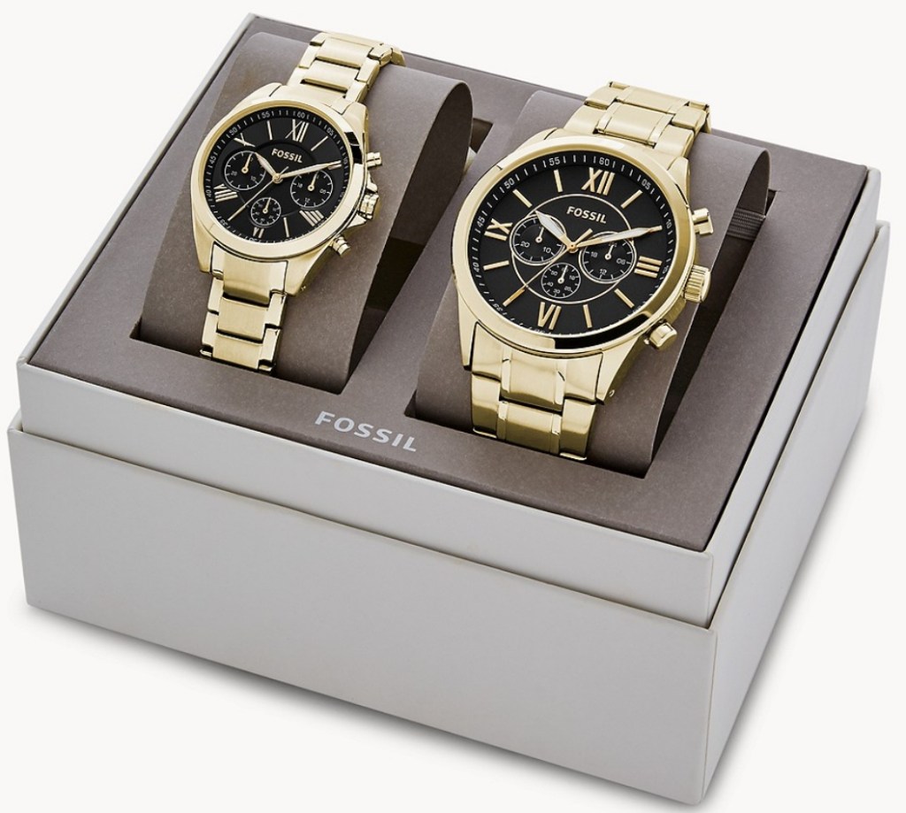 Two gold watches in a box