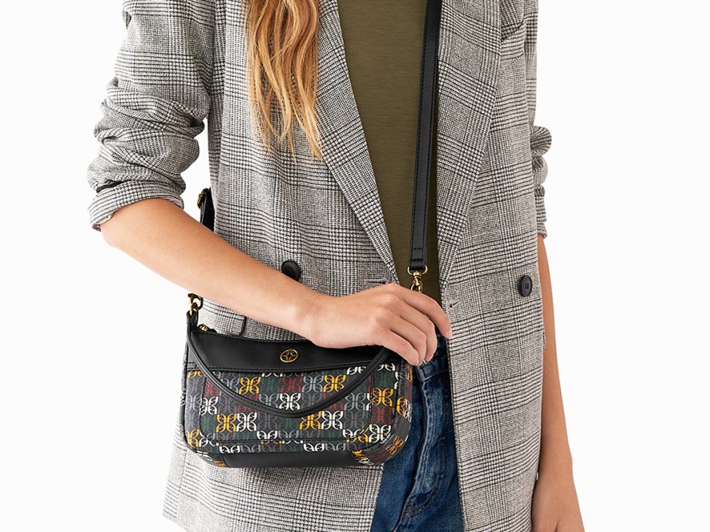 woman with a black printed crossbody bag