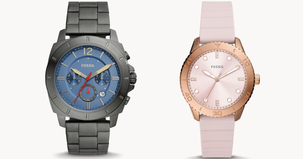 Dark grey watch with blue face and a pink watch with rose gold case and pink face