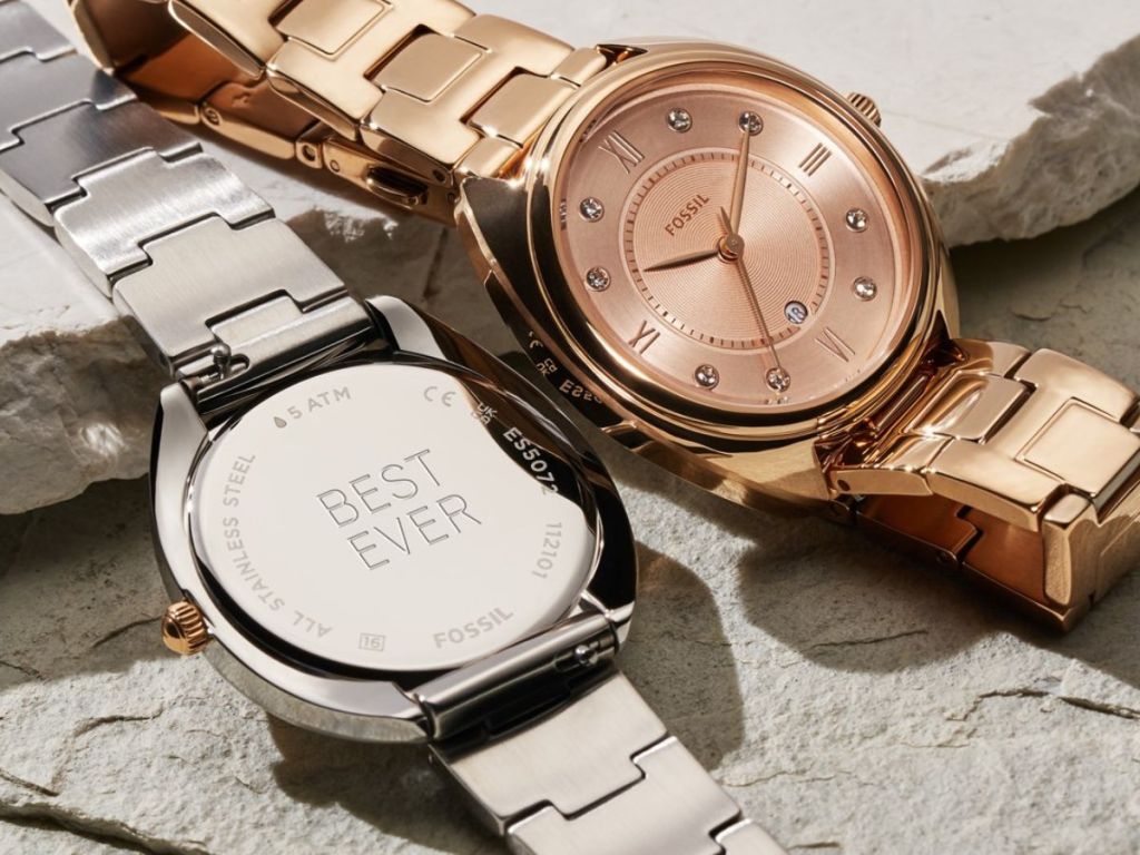 Two Fossil watches, one in silver and one in rose gold