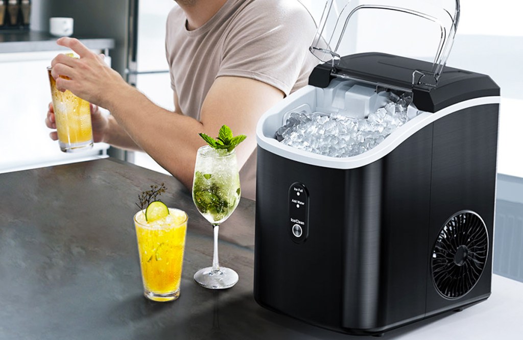 two drinks on counter next to black countertop ice maker