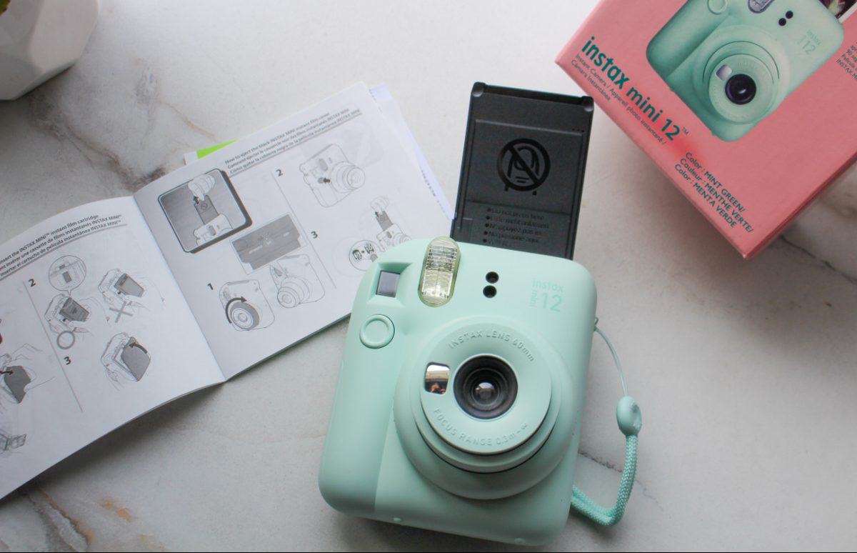 The Fuji Instax Mini 12 Camera with instructions booklet and film