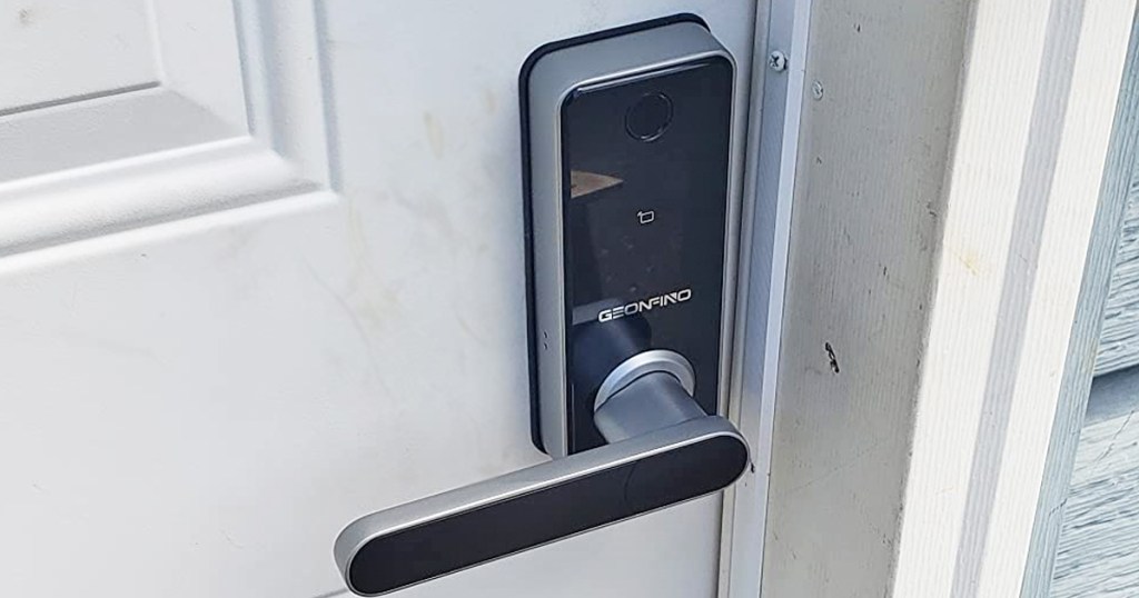 silver and black door lock on white door