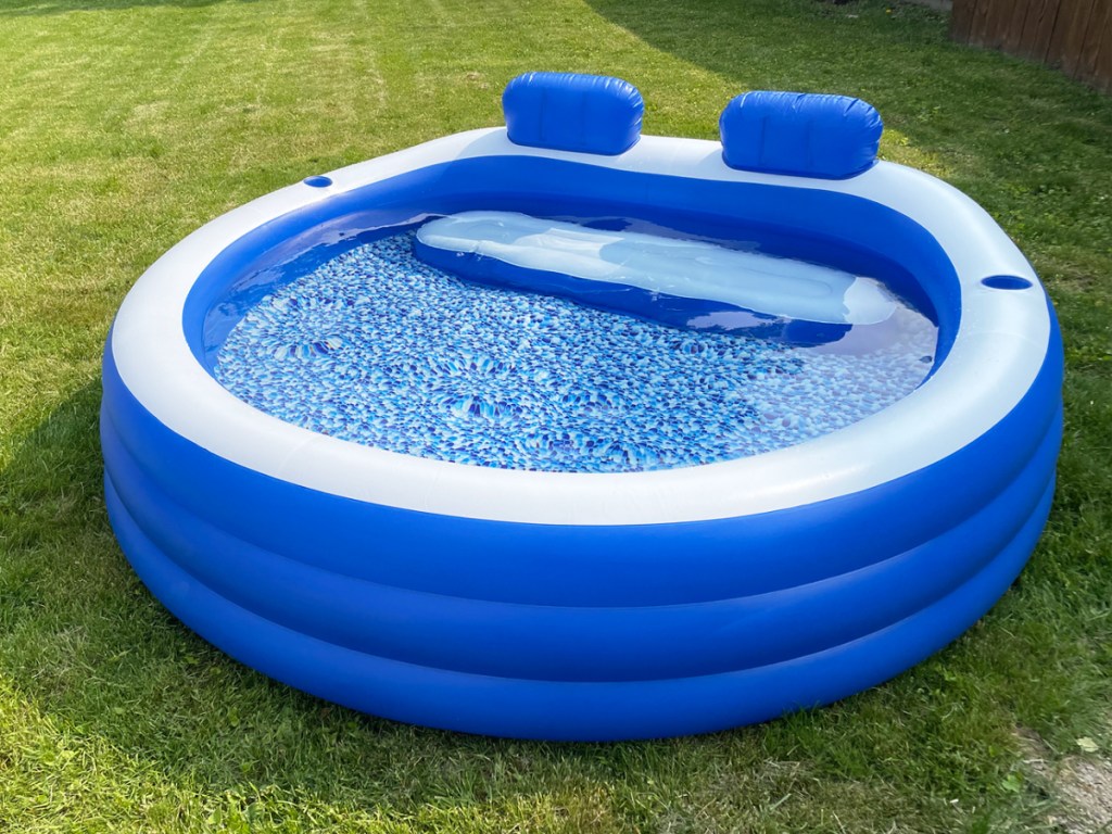blue inflatble pool with bench seat and headrests