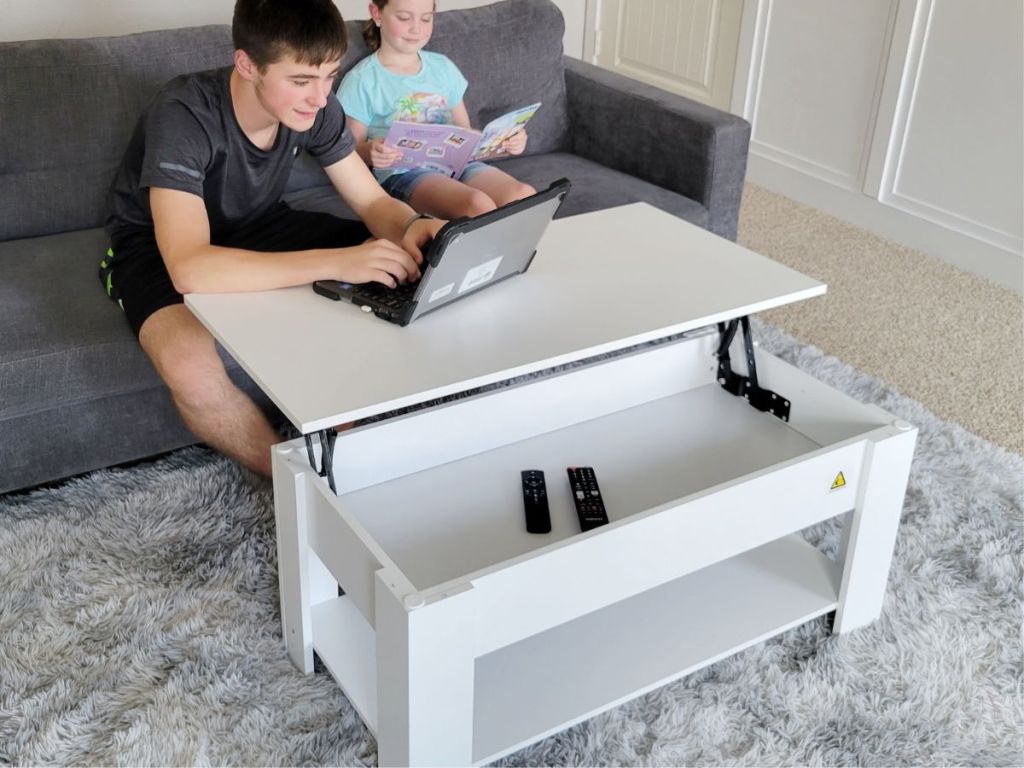 Teens using a Yaheetech Lift-Top Coffee Table with Hidden Storage in White