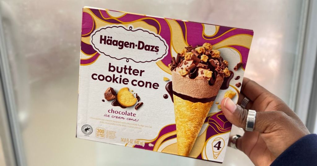 person holding 4-pack of Haagen Dazs Cookie Ice Cream Cones