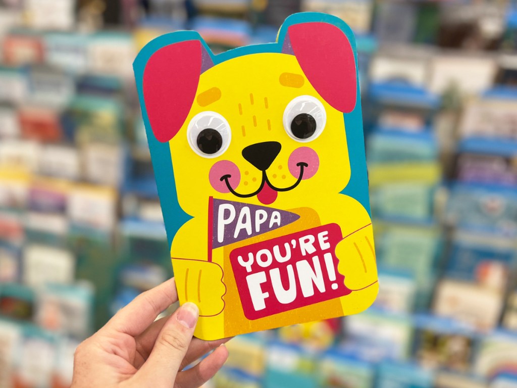 holding a yellow dog father's day card