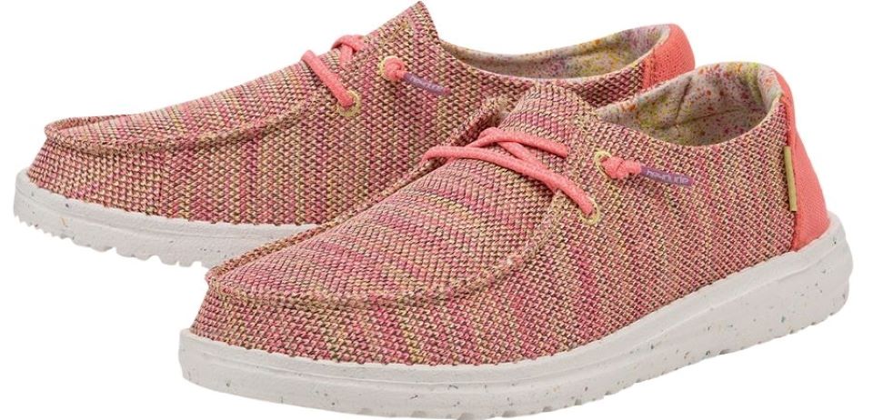 Pair of pink Hey Dude shoes with white soles