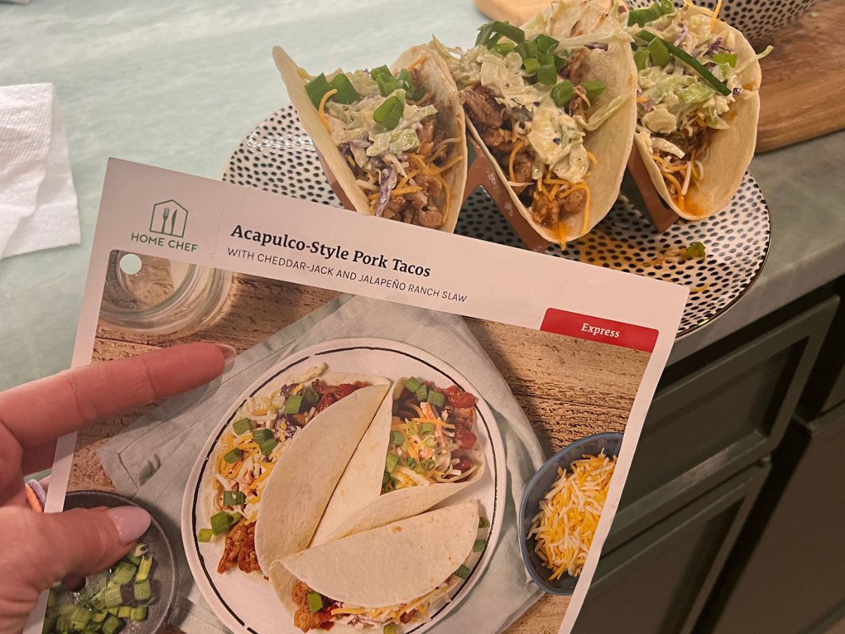 home chef tacos with recipe instructions sheet held up in front of them