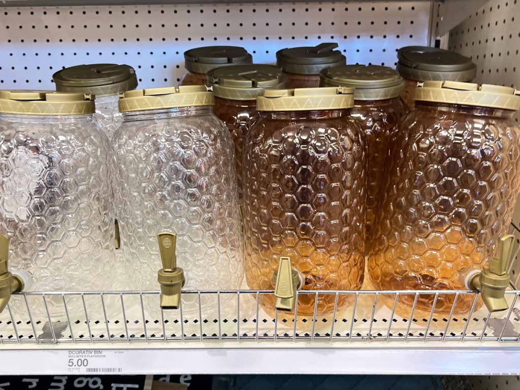 shelf full of plastic Honey Comb Beverage Dispensers