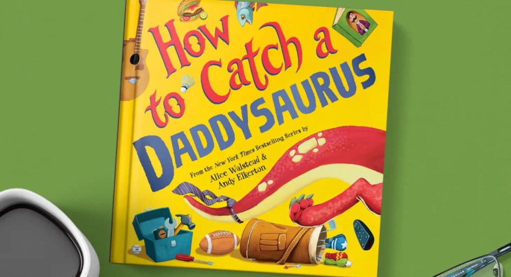 How to Catch a Daddysaurus hardcover book with coffee and glasses
